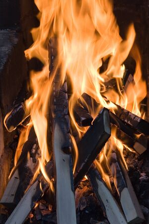 Fire at night. The beautiful flame can be used as a background for a composition.の写真素材