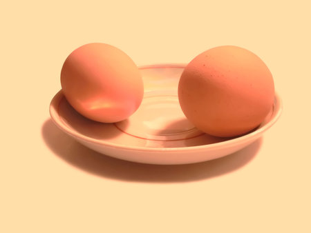 2 chicken eggs on a small plate