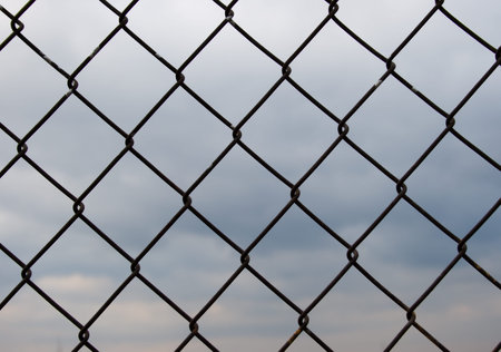Metal grid which can be used as a backgroundの写真素材