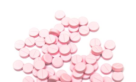 Set of pink tablets on whiteの写真素材