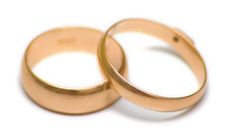 Pair wedding rings on white. The traditional attribute symbolizing registration of new familyの写真素材