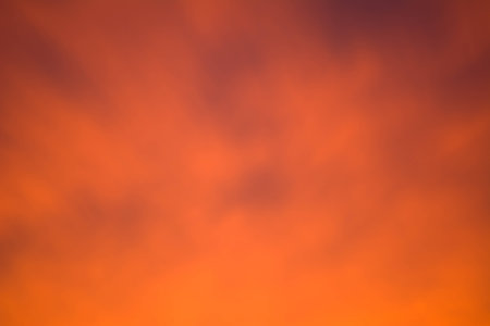 soft sunset sky background, gradient of orange and purpleの写真素材