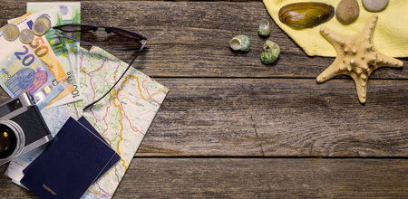 Summer travel stuff on a wooden background with marine details