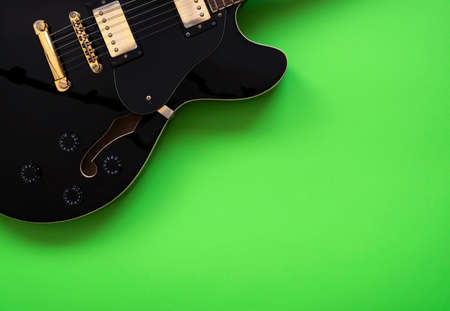 Electric guitar on a green backgroundの写真素材