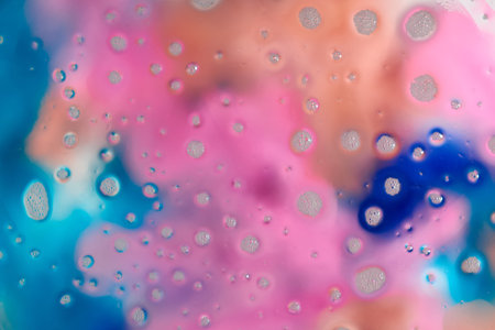 Soap foam on a colorful blurred background. Closeup.の写真素材