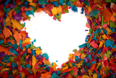 White heart-shaped surface surrounded by multicolored shavings. Closeup.の写真素材