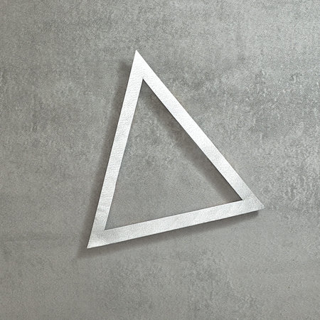 Simple triangular silver frame on a concrete gray background. Text space. Top view. Minimal style.