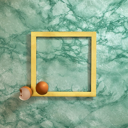 Egg shells in the corner of a gold frame on a green marble background. Text space. Top view. Minimal...
