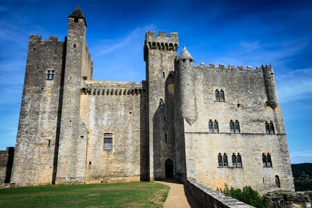 Medieval architecture of impressive Chateau de Beynac castle, built on the cliffs high above Dordogne river in Beynac-et-Cazenac, Perigord, France.のeditorial素材