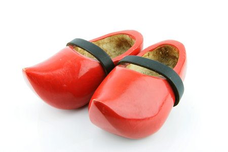 Red wooden shoes   Dutch clogs with a black leather strap  Traditional Dutch footwear for farmers の写真素材