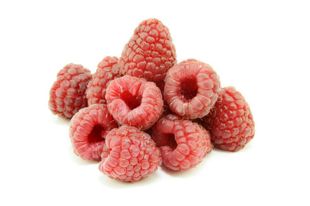 A pile of fresh ripe Raspberries on a white background 