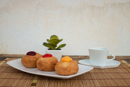 Colorful bakery on a white ceramic plate. Food morning.