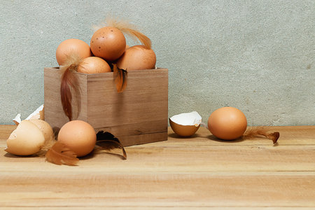 rustic still life with eggs on wooden box.
