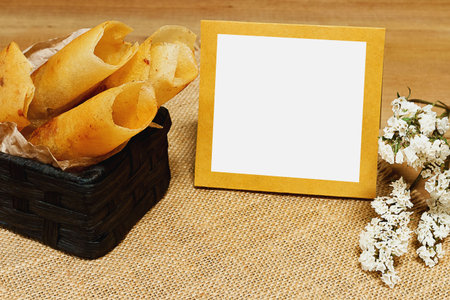 Fried banana spring rolls, statice white, with white copy space