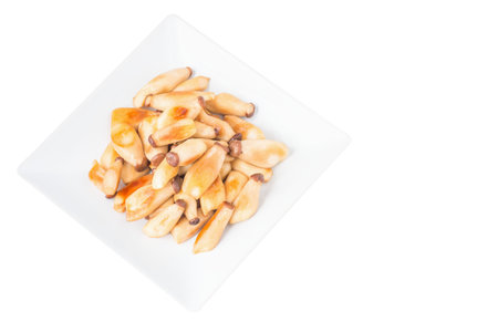 Fried king oyster mushrooms, eringi mushrooms with butter in ceramic dish