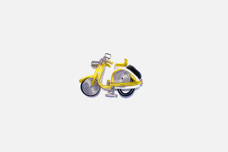 Yellow motorcycle model isolated on white background. Handmade is everywhere.