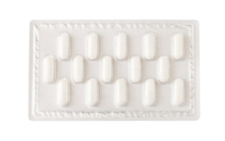 Medical pill capsules in blister packs isolated on white background