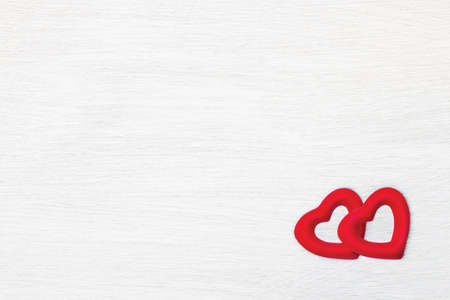 Two red hearts on white wood plank texture for background. Valentines Day conceptの写真素材