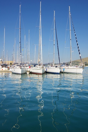 Picturesque landscape with  yachts in port with reflection. Croatiaの写真素材
