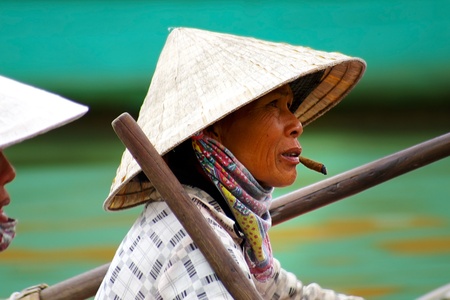 HOI AN, VIETNAM- JANUARY 17: Portraits of the woman-ferryman on a street in Hoi An.のeditorial素材