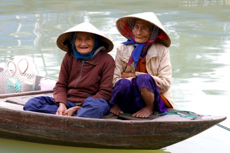 HOI AN, VIETNAM- JANUARY 17: Portraits of the old women on a street in Hoi An.のeditorial素材