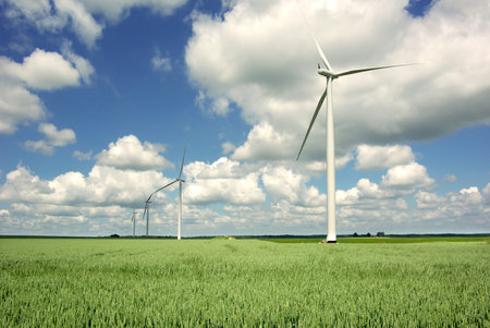 Wind generator on a background of the blue sky  