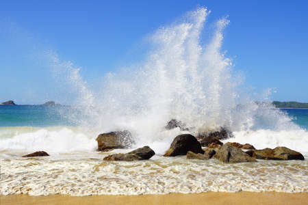 Big wave crashes on to the shore. Nacpan Beach. El Nidoの写真素材