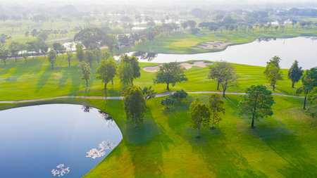 Aerial view of golf field landscape with sunrise view in the morning shot. Bangkok Thailandの写真素材
