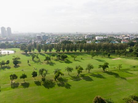 Aerial top view photo from flying drone of Golf Course, Lush green grass on golf courseの写真素材