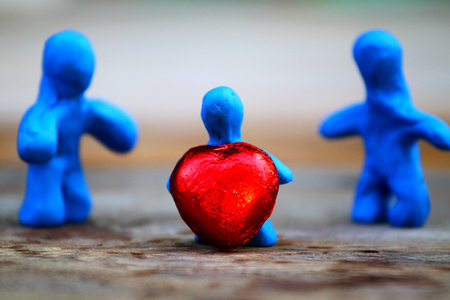 model human clay family on wood texture.の写真素材