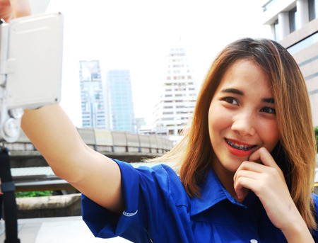 Close-up woman smile selfie portrait and traveling in the city.の写真素材