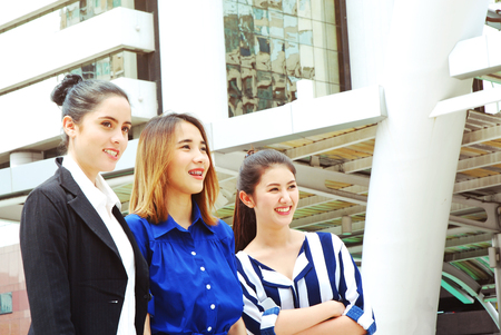 Beautiful three woman business smile portrait and relaxation at outdoor.の写真素材