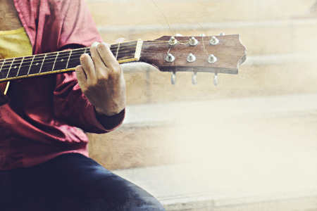 Abstract beautiful playing acoustic Guitar in the foreground on Watercolor painting background and Digital illustration brush to art.の写真素材