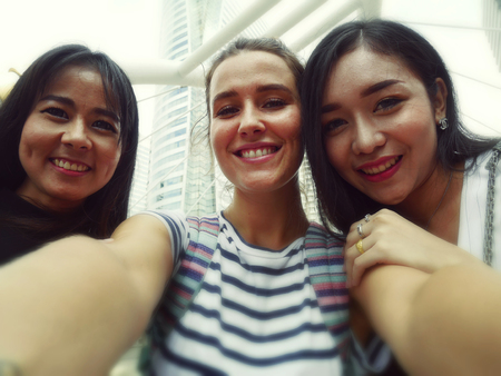 Beautiful woman take photo selfie and blur background.の写真素材