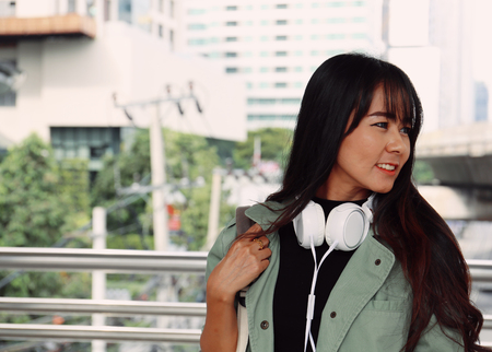 Beautiful women smile and holding bag traveling in the capital city.の写真素材