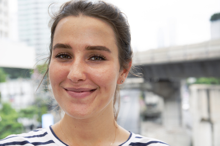 Close-up beautiful woman happy smile portrait and traveling in the city.の写真素材