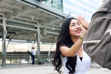 Beautiful Asia woman very happy with girlfriend for traveling vacations on walking street in the...