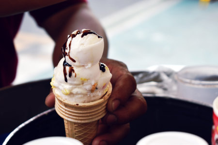 Hand holding Ice cream thai food on street food in Bangkok, Thailand.