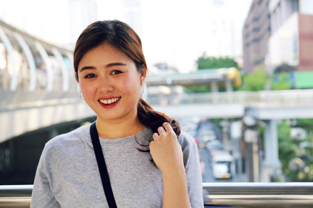 Beautiful Asia Woman smile portrait and traveling in capital city.の写真素材