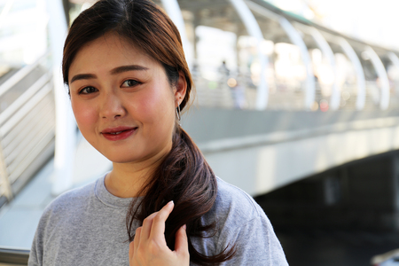 Beautiful asia woman smile portrait and traveling in city.の写真素材