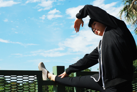 Beautiful girl portrait and running in the public park.の写真素材