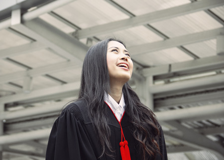 Beautiful Asia girl students are happy after graduation.の写真素材