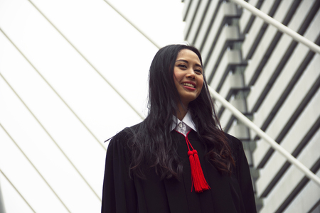 Beautiful Asia girl students are happy after graduation.の写真素材