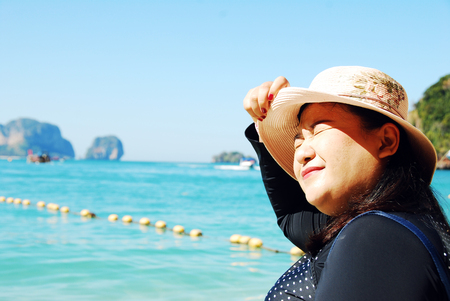 Beautiful Asia woman traveling beach in Thailand on summer holiday.のeditorial素材