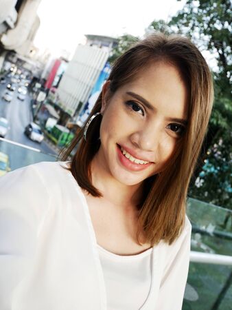 Close-up beautiful Asia woman selfie portrait and traveling in capital city.の写真素材