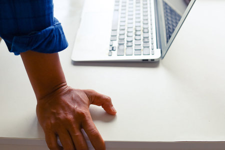 Close-up businessmen hands on laptop and creative job on table at homework.
