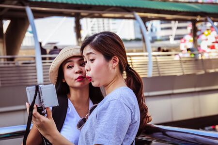 Close-up beautiful woman selfie photo smile portrait and traveling the city.の写真素材