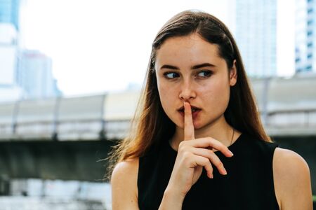 Close-up Beautiful woman happy portrait and office building background.の写真素材