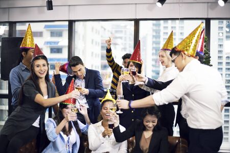 Business persons happy new year party in the offices.の写真素材