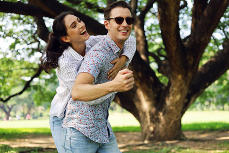 Young couples are enjoying and happy in the holiday activities at garden park.